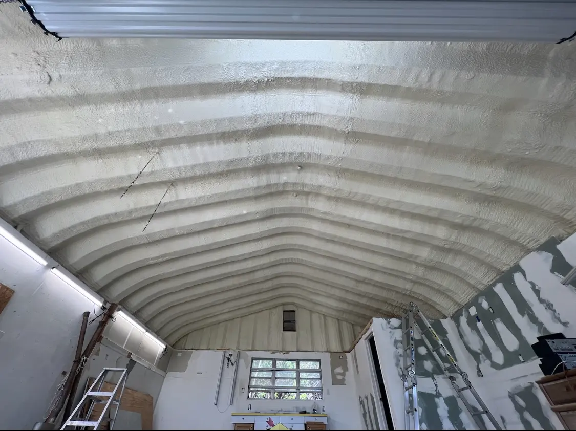 Spray polyurethane foam applied to the underside of a metal roof deck in South Hill